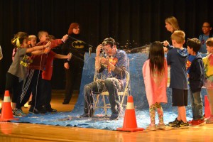 Springville Elementary students cover teacher in aerosol string as part of Leukemia and Lymphoma fundraiser