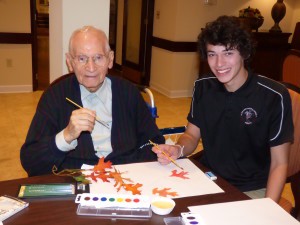 Students from King’s Christian School design leaves with Spring Hills’ residents
