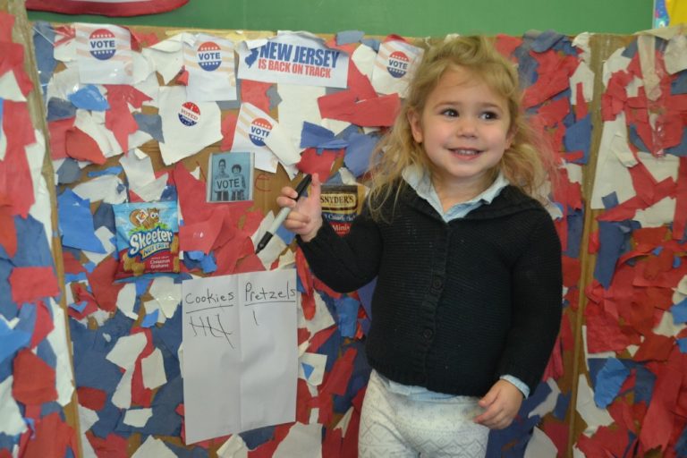 Sari Isdaner Early Childhood Center students choose between cookies and pretzels on Election Day