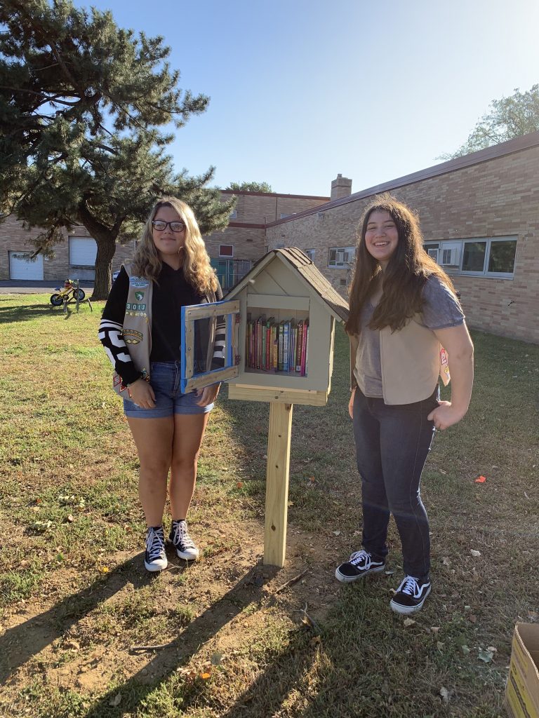 Local Girl Scout pair provide the gift of reading to youth