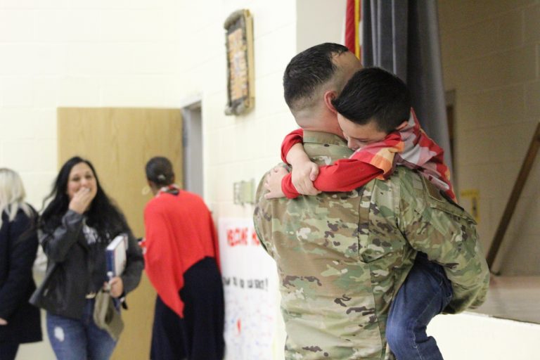 Double the surprise: Soldier, son reunite at Indian Mills School