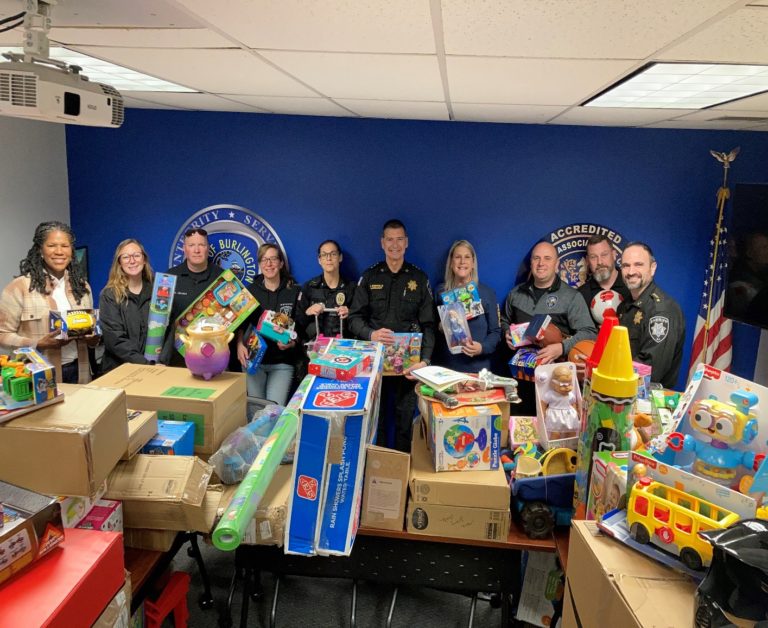 County sheriff’s department partners with Burlington City police to distribute toys, household goods