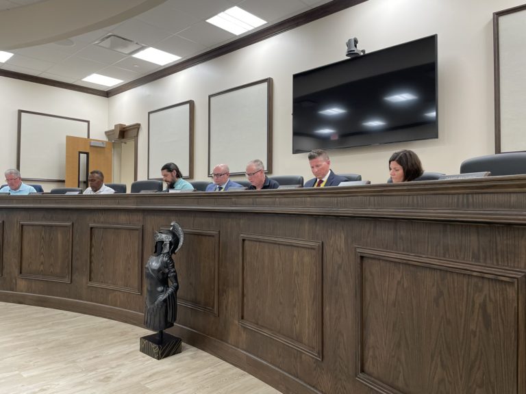 Residents challenge board’s district terminations