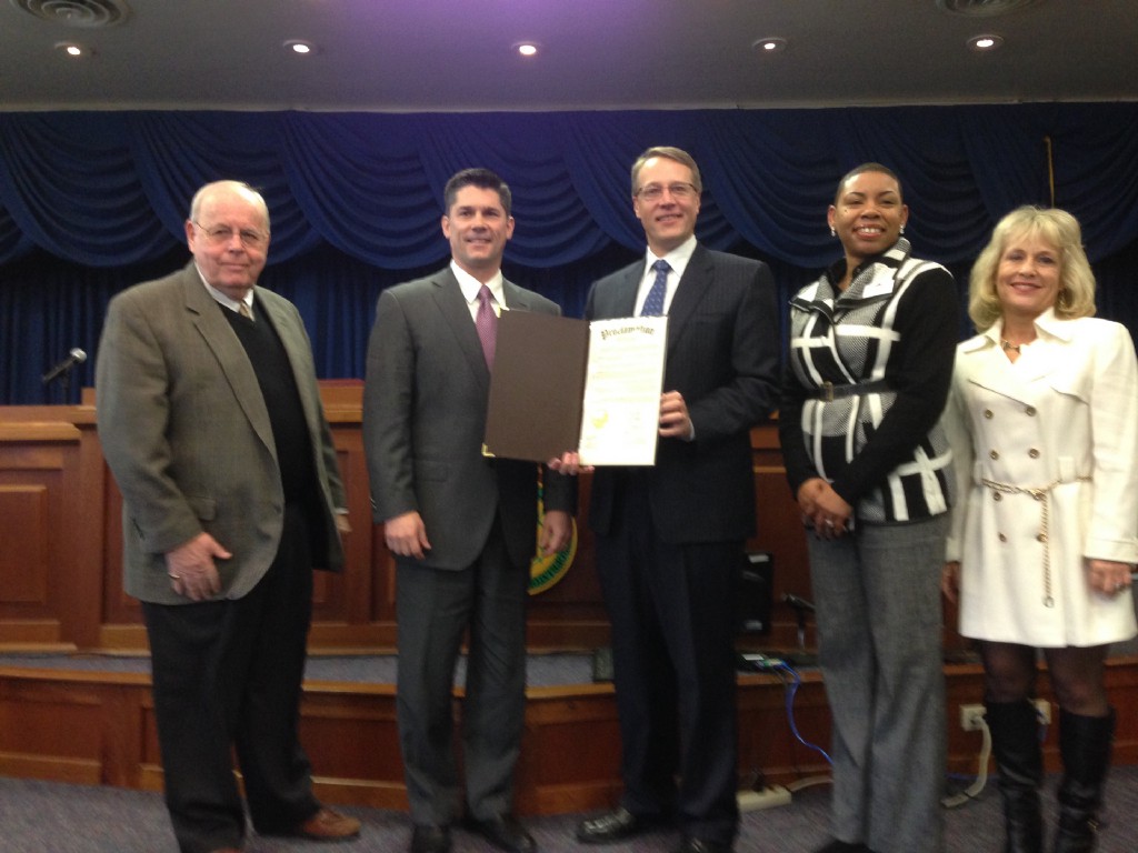 From left, Commissioner Charles H. Martin, Robert G. Loughery, Chair of the Board of Commissioners, Impact Thrift’s CEO, Gray Wirth, Impact Thrift’s Director of Community Outreach, Tamika Miller, and Commissioner Diane Ellis-Marseglia 