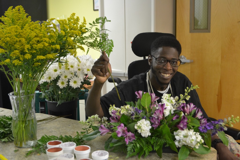 PHOTO: KATIE CARNEVALE  / Yellow Daffodil, 194 N. Pine St. in Langhorne, opened earlier this month. Everyting sold at the shop was made by individuals with physical, developmental and intellectual disabilities. Above, Don is a part-time employee who specializes in flower arrangements and card making.html-charsetutf-8