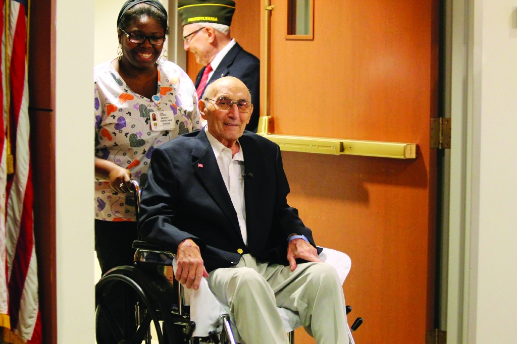 Korean War veteran William “Ron” Arpino accepts a replica of the Purple Heart on Aug. 11 at Holy Redeemer Hospital. He declined the award decades ago. At the time, in 1953, he feared that his family, especially his mother, would have been worried when notified of his injuries.html-charsetutf-8