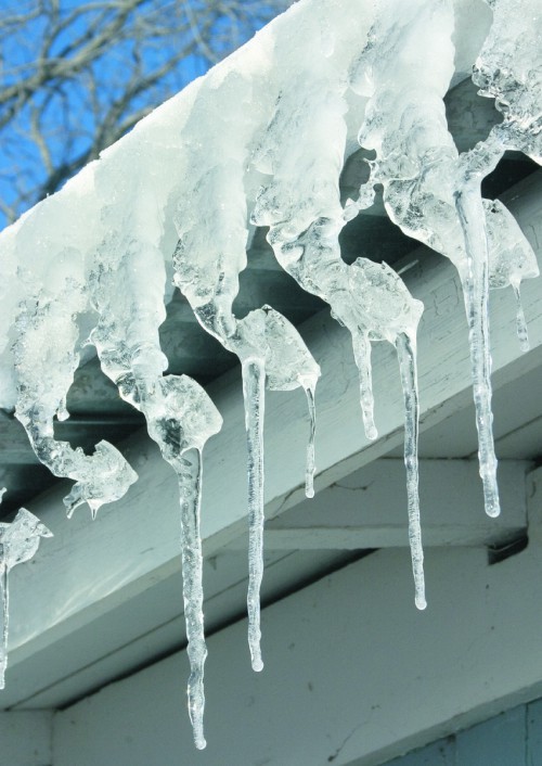 METRO IMAGES Homeowners should check for ice forming near gutters and eaves on a roof. It can cause ice damming, a problem that can lead to damages and leaks.html-charsetutf-8