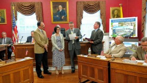 Left to right: Gene Williams and Dana Barber of the Grundy Foundation receive a proclamation and plaque honoring the Grundy Library from Bristol Borough Council member Tony Riccio and Mayor Pat Sabatini